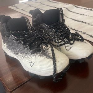 Under Armor Boys football cleats.